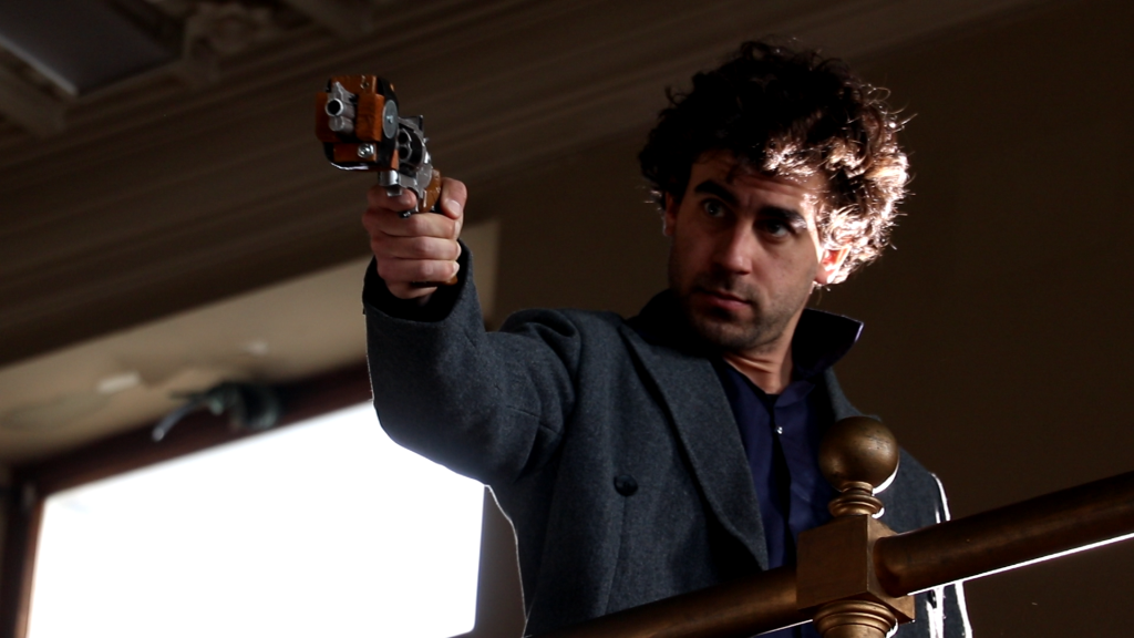 Image of main character pointing a gun